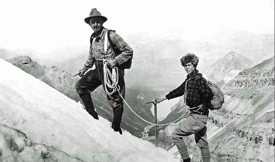 Ernest Fuez and Georgia Engelhard climb the snow ridge on Mount Victoria.