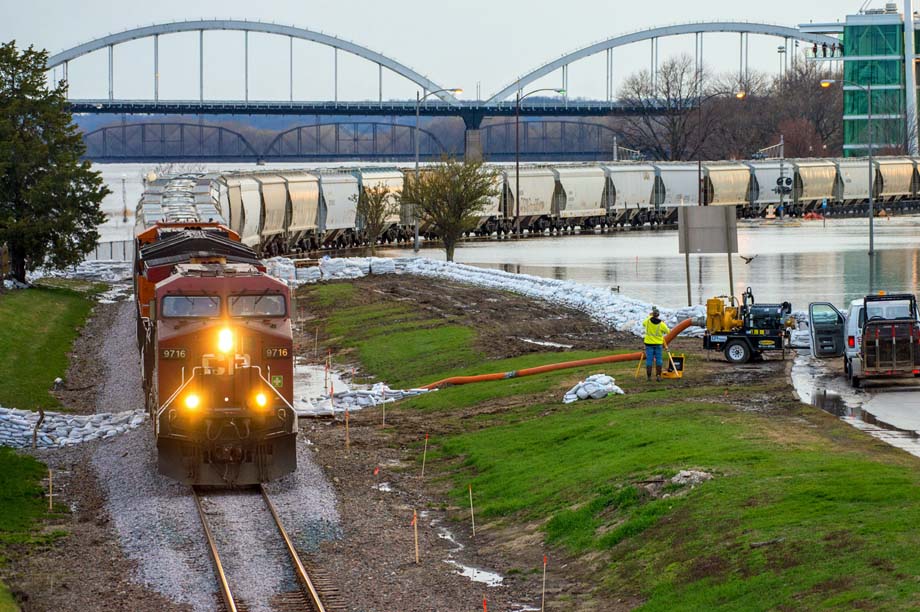 A CP train tiptoes through floodwaters in Davenport.