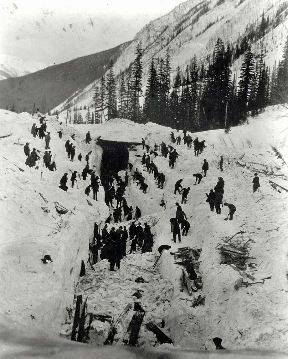 Men clear the track in Rogers Pass.