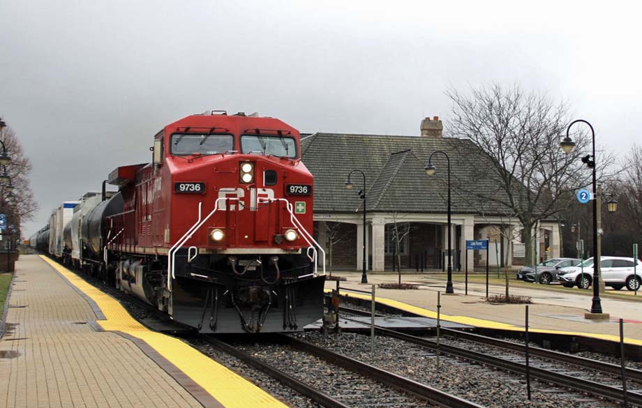 A CP train passes the Metra station in Lake Forest, Illinois.