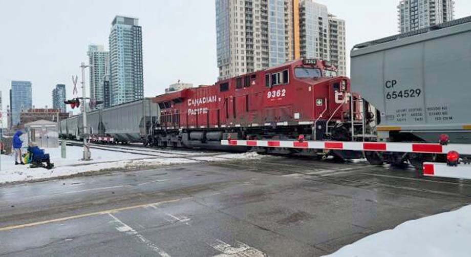 A CP freight train rolls through downtown Calgary.
