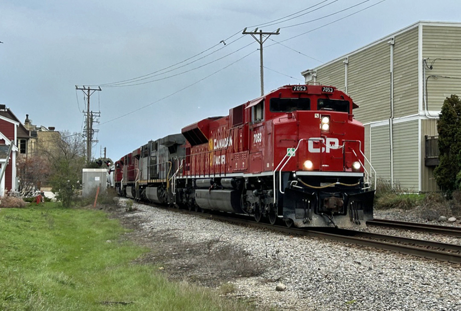 CP and KCS locomotives handle a freight.